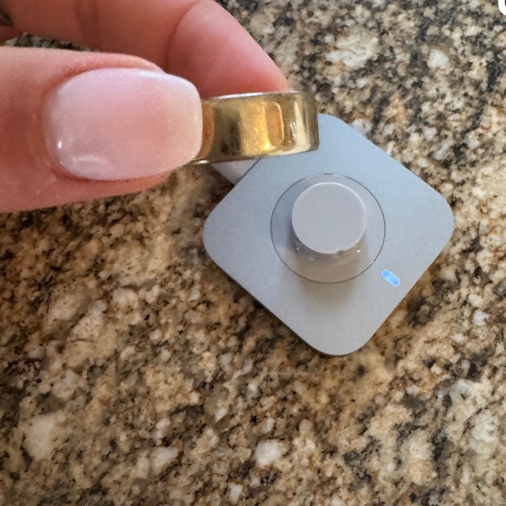 Oura Gold Ring with Charging Base